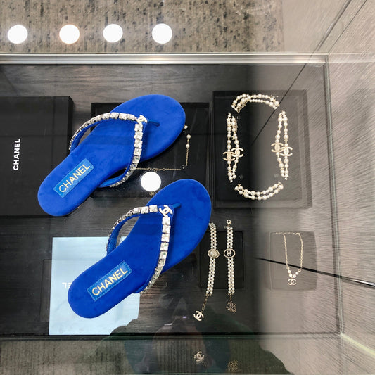 THONG SLIDE IN COBALT BLUE SUEDE WITH WHITE CRYSTALS