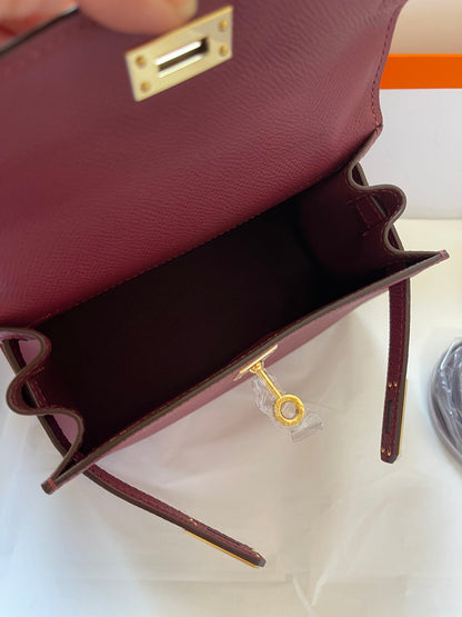 KELLY MINI 20 BAG IN GARNET RED CALFSKIN WITH GOLD HARDWARE