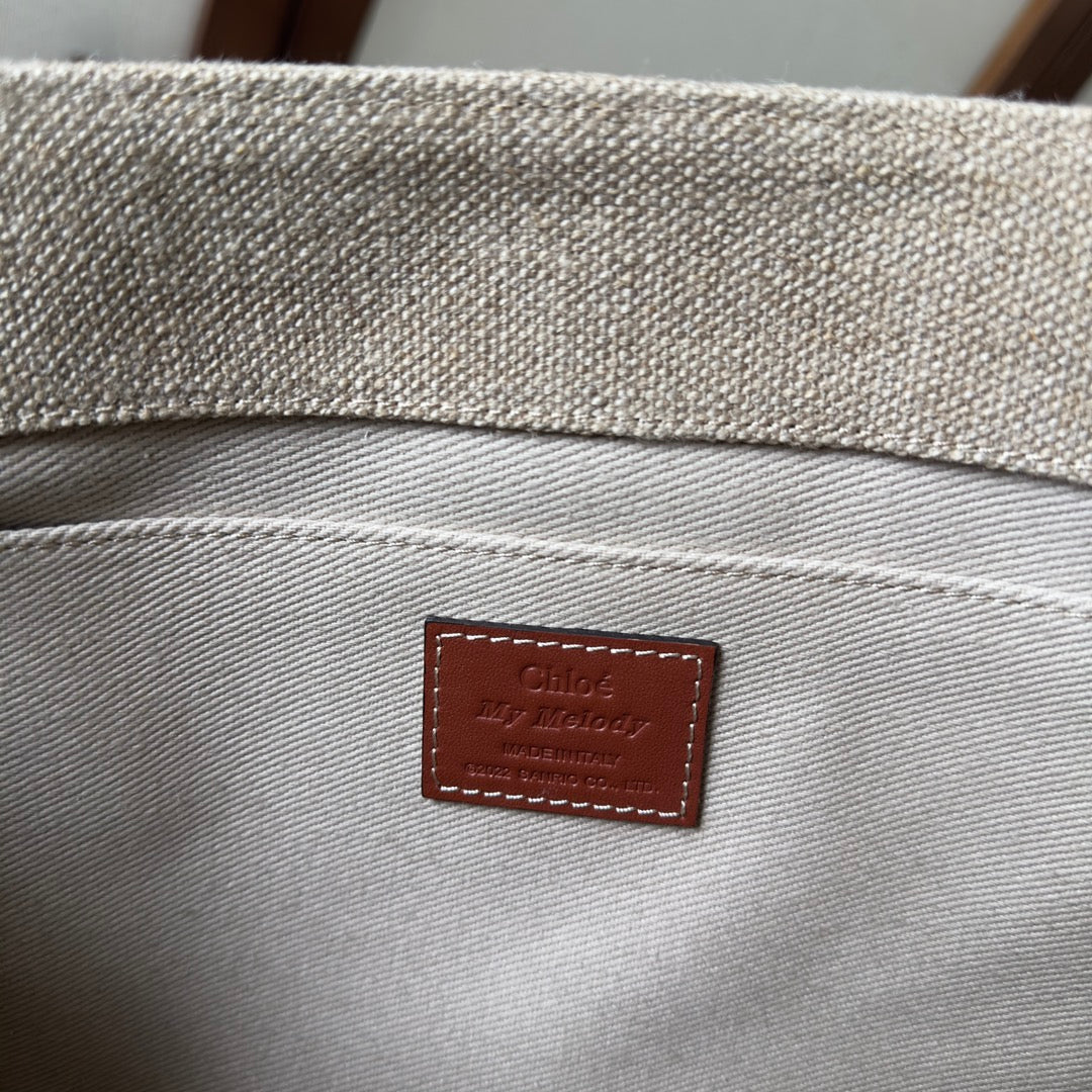 MY MELODY MEDIUM WOODY TOTE BAG 37 IN NATURAL FIBERS BEIGE WEBBING BROWN CALFSKIN