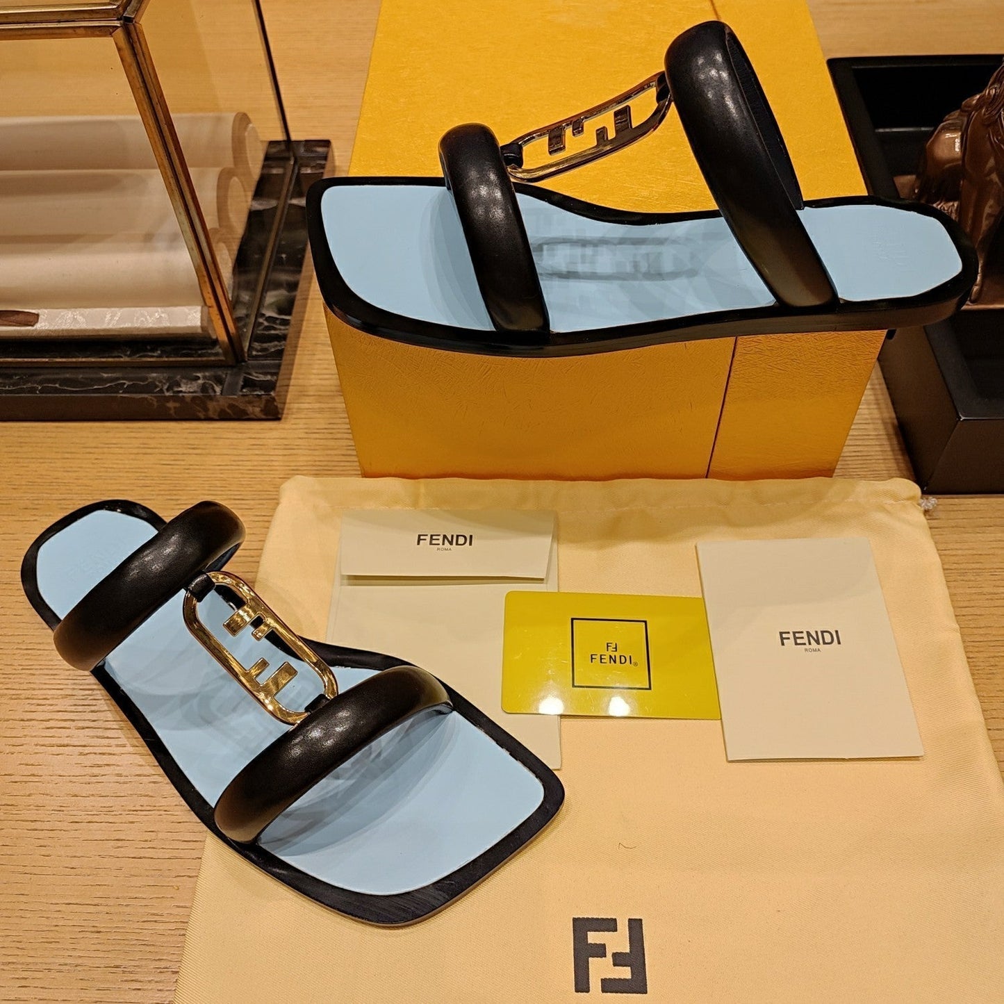 FENDI O'LOCK SLIDES BLACK AND LIGHT BLUE CALFSKIN WITH GOLD HARDWARE