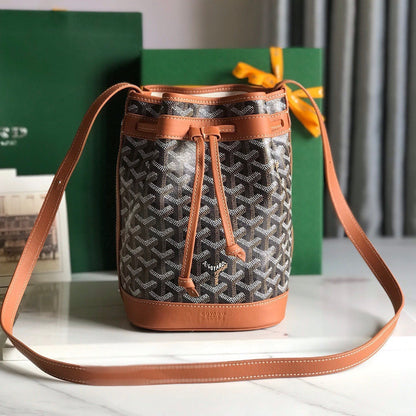 PETIT FLOT BUCKET BAG 22 IN BLACK GOYARDINE CANVAS AND TAN LAMBSKIN TRIM