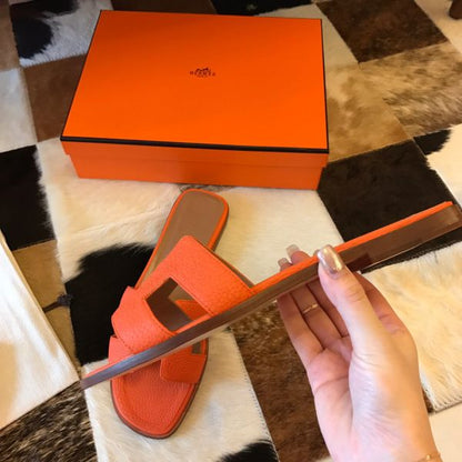 HERM Oran Slide Sandals In Orange Clemence Leather
