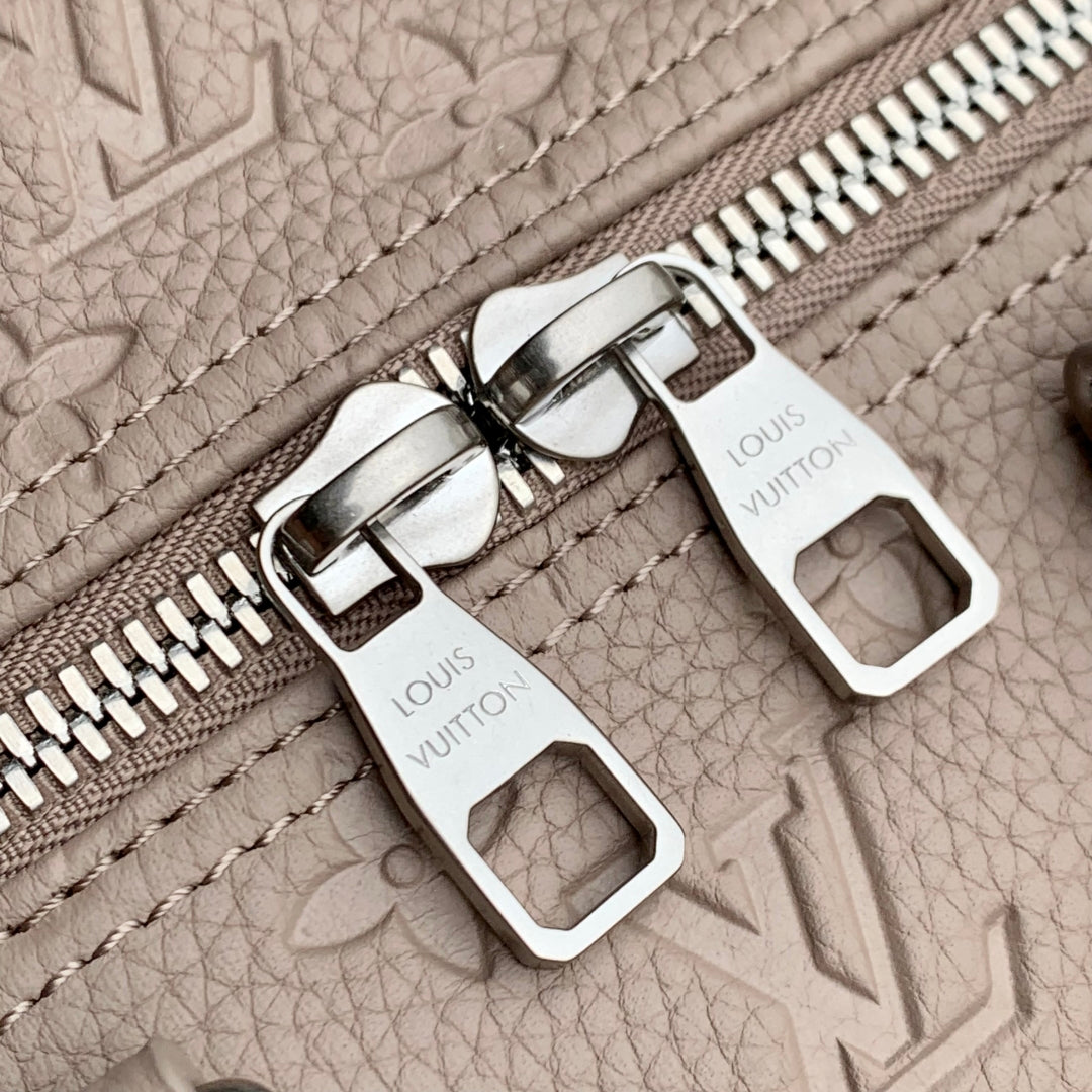 KEEPALL BANDOULIÈRE 34 BAG IN LIGHT BROWN MONOGRAM TAURILLON CALFSKIN