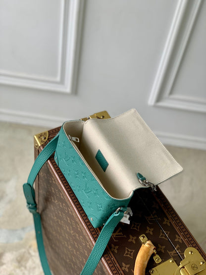 STEAMER WEARABLE WALLET 18 IN TEAL GREEN MONOGRAM TAURILLON CALFSKIN