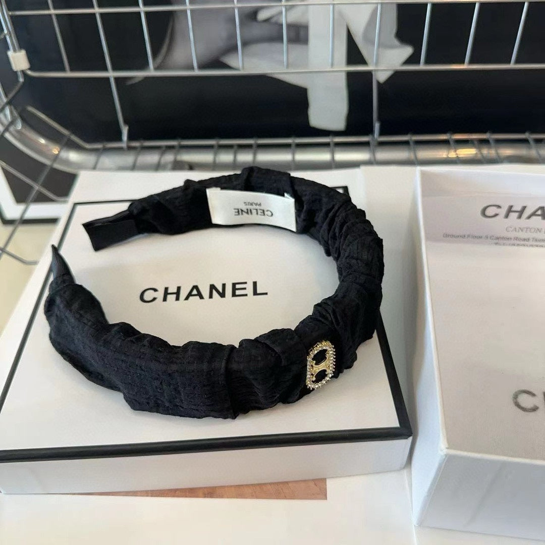 BLACK FABRIC WITH GOLD LOGO HAIRBAND 414448