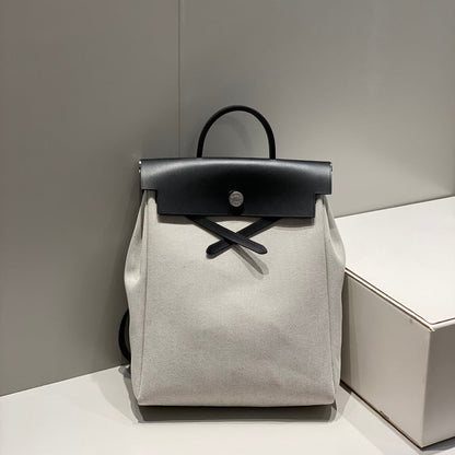 HERBAG A DOS ZIP RETOURNE BACKPACK 29 IN OFF-WHITE CANVAS AND BLACK CALFSKIN