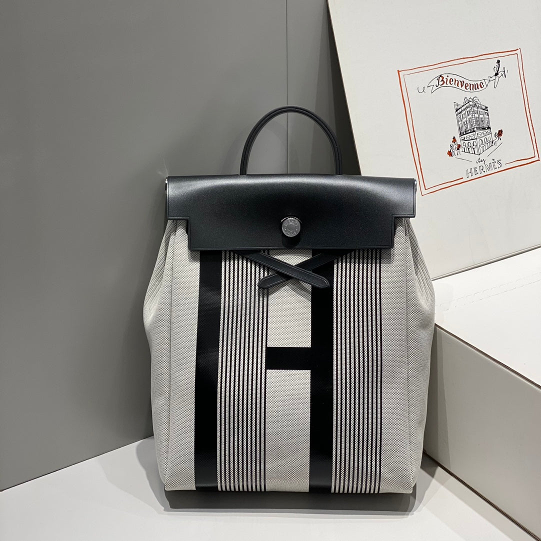 HERBAG A DOS ZIP RETOURNE BACKPACK 29 IN OFF-WHITE MIX BLACK CANVAS AND CALFSKIN