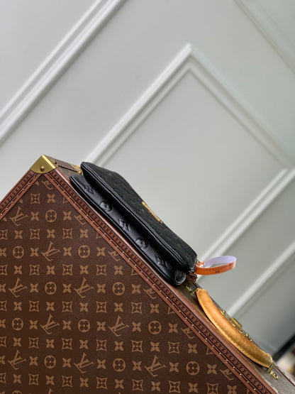 LIV POCHETTE BAG 24 IN BLACK MONOGRAM EMPREINTE LEATHER