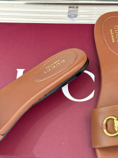 SLIDE SANDALS IN BROWN CALFSKIN WITH GOLD HARDWARE