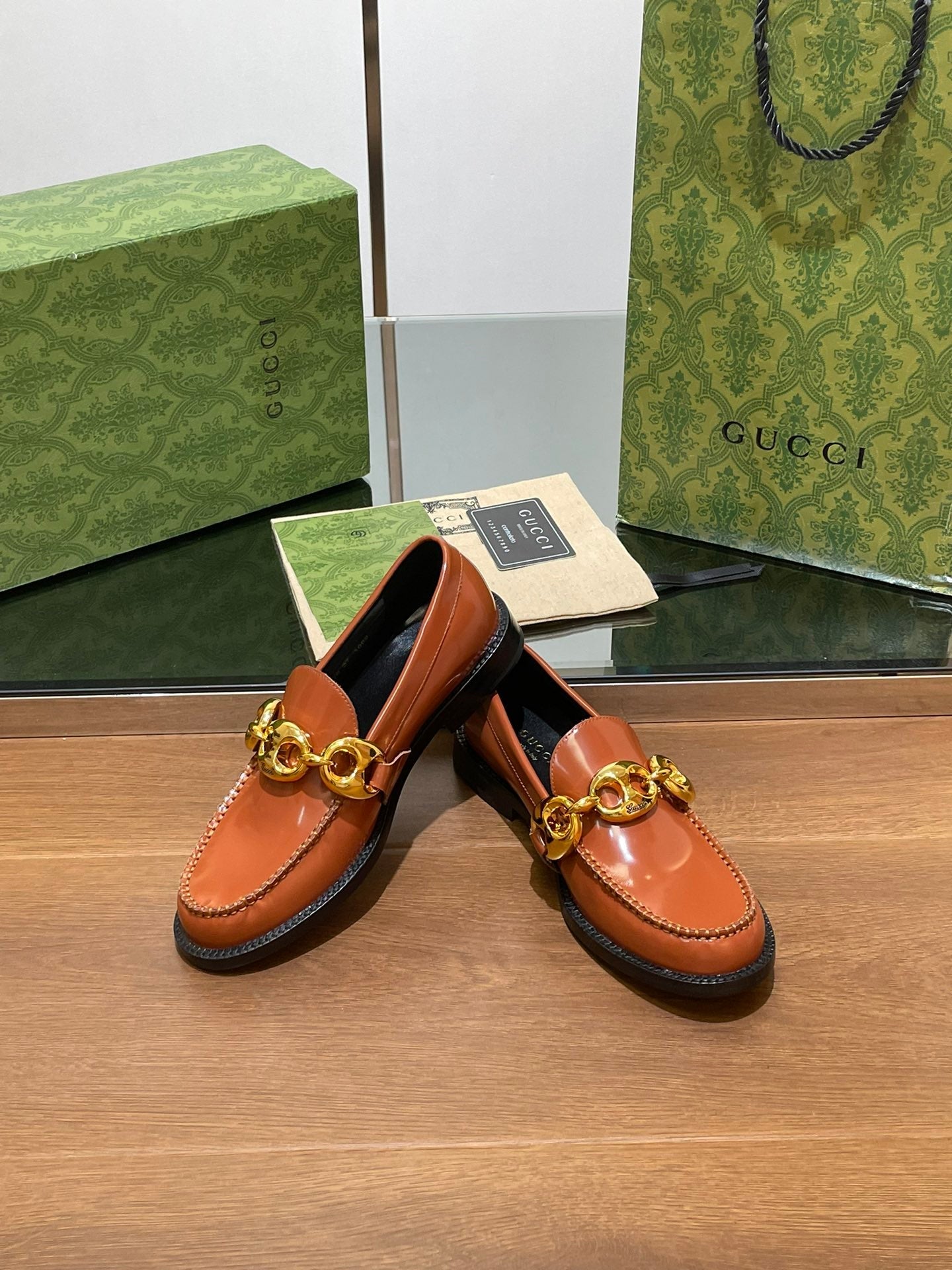 GG LOAFER SHOES IN BRONZE BROWN CALFSKIN WITH GOLD HARDWARE