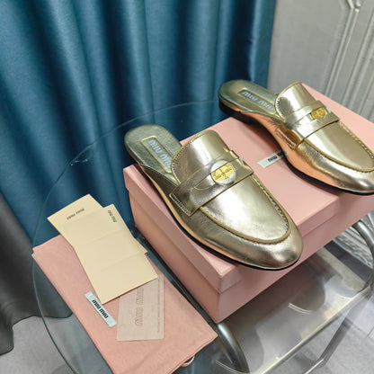MULES SLIPPERS METALLIC GOLD COWHIDE WITH GOLD COIN