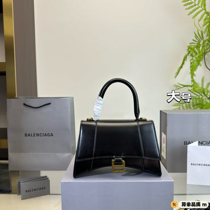 HOURGLASS HANDBAG 22 IN BLACK SHINY BOX CALFSKIN GOLD HARDWARE