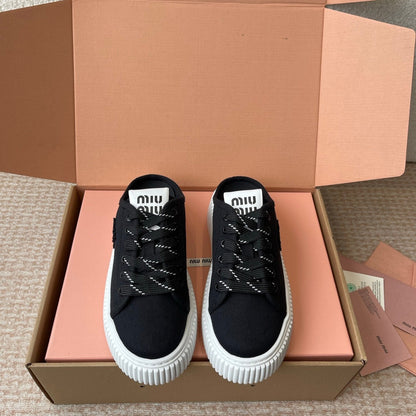 WASH SNEAKER MULES IN BLACK DENIM