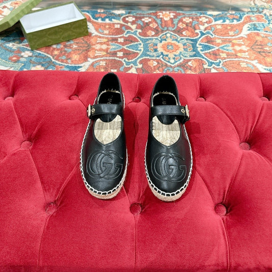 GG CROSS STRAP FLAT SHOES IN BLACK CALFSKIN WITH STRAW SOLE