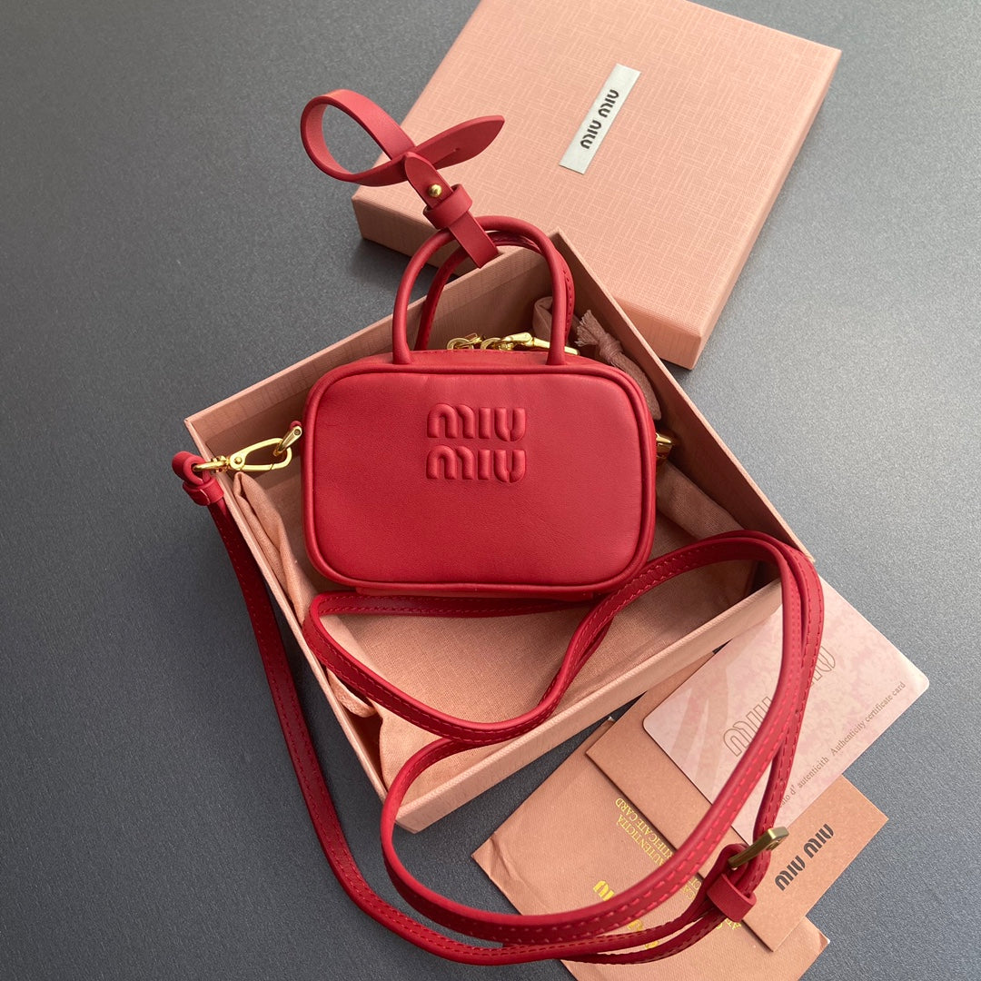 MICRO BAG KEYCHAIN 11 IN TALL POPPY RED CALFSKIN EMBOSSED LOGO