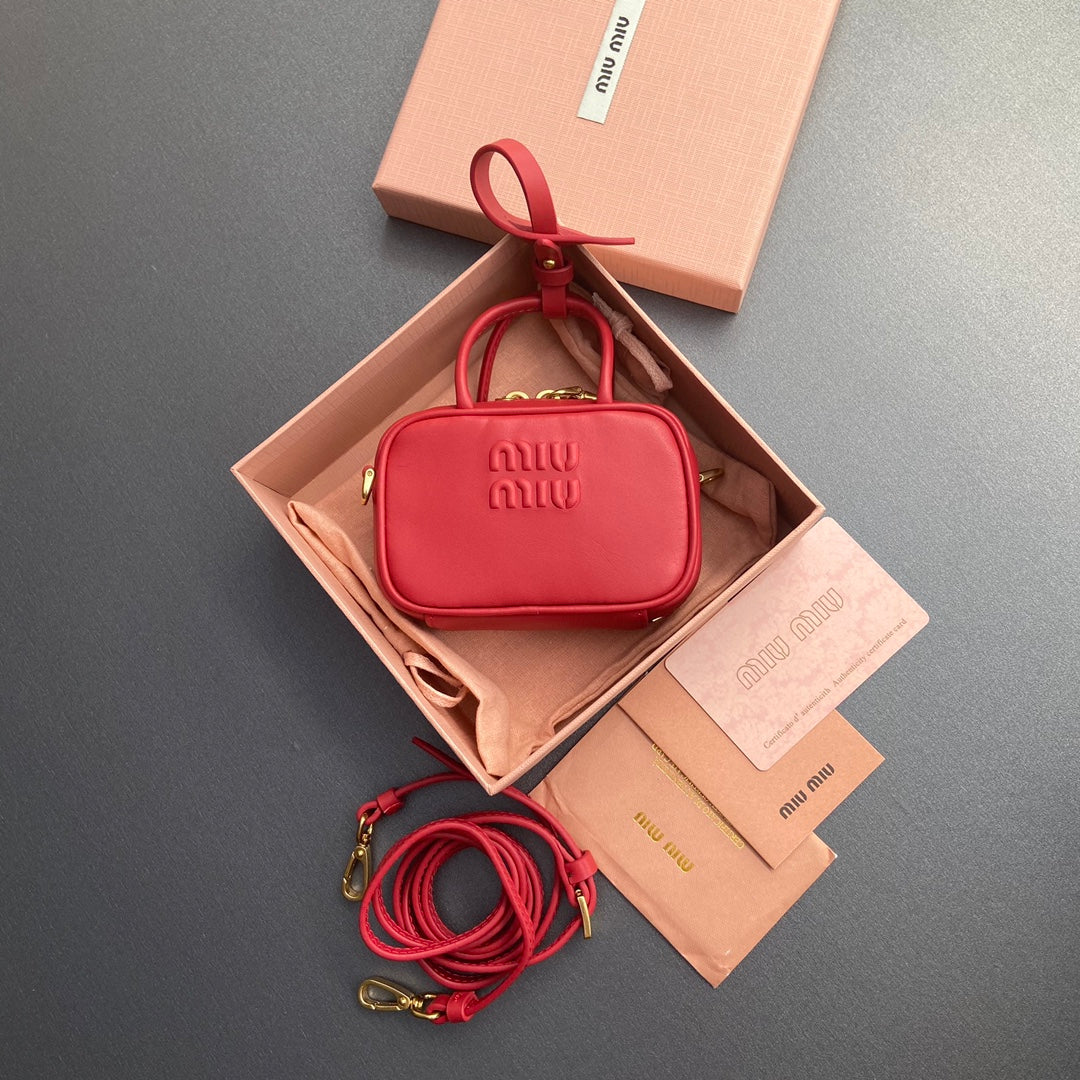 MICRO BAG KEYCHAIN 11 IN TALL POPPY RED CALFSKIN EMBOSSED LOGO