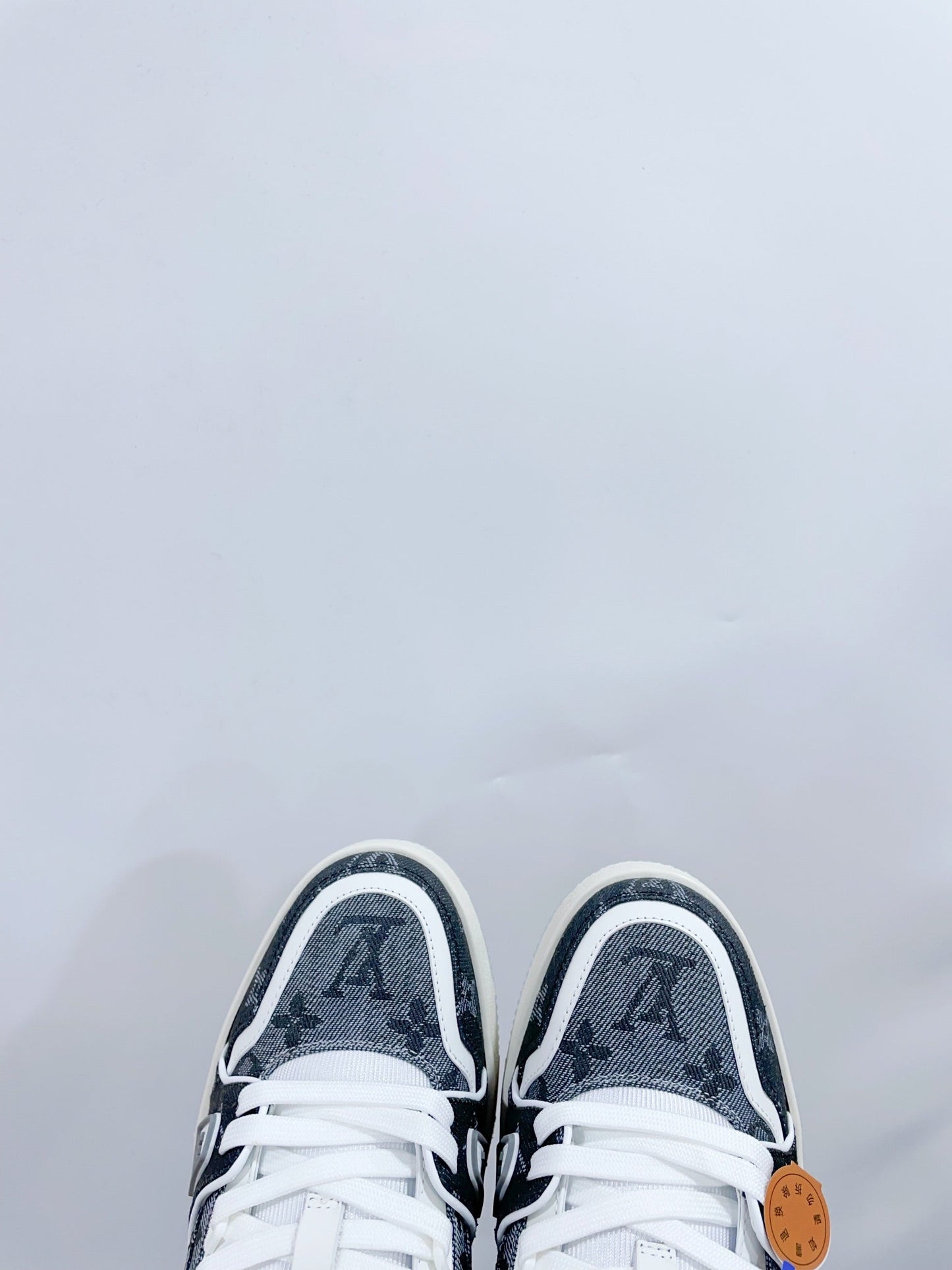 LV TRAINER SNEAKER IN DOVE GRAY MONOGRAM DENIM