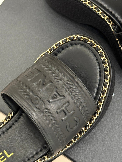 THICK SOLE WEDGE SLIPPERS IN BLACK CALFSKIN