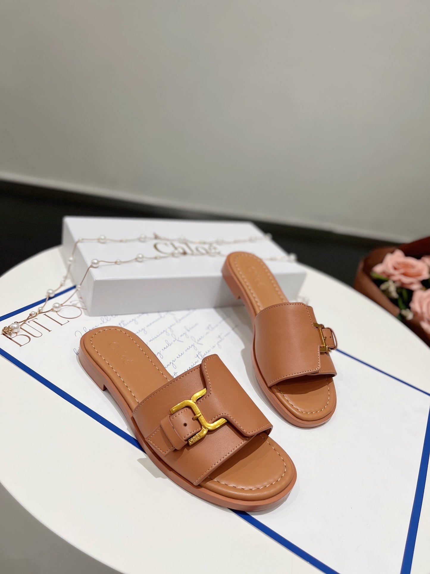 MARCIE SLIDE IN BRONZE BROWN CALFSKIN WITH GOLD HARDWARE