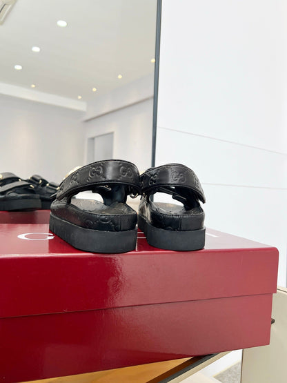 VELCRO STRAP SANDALS IN BLACK EMBOSSED LOGO LAMBSKIN GOLD HARDWARE