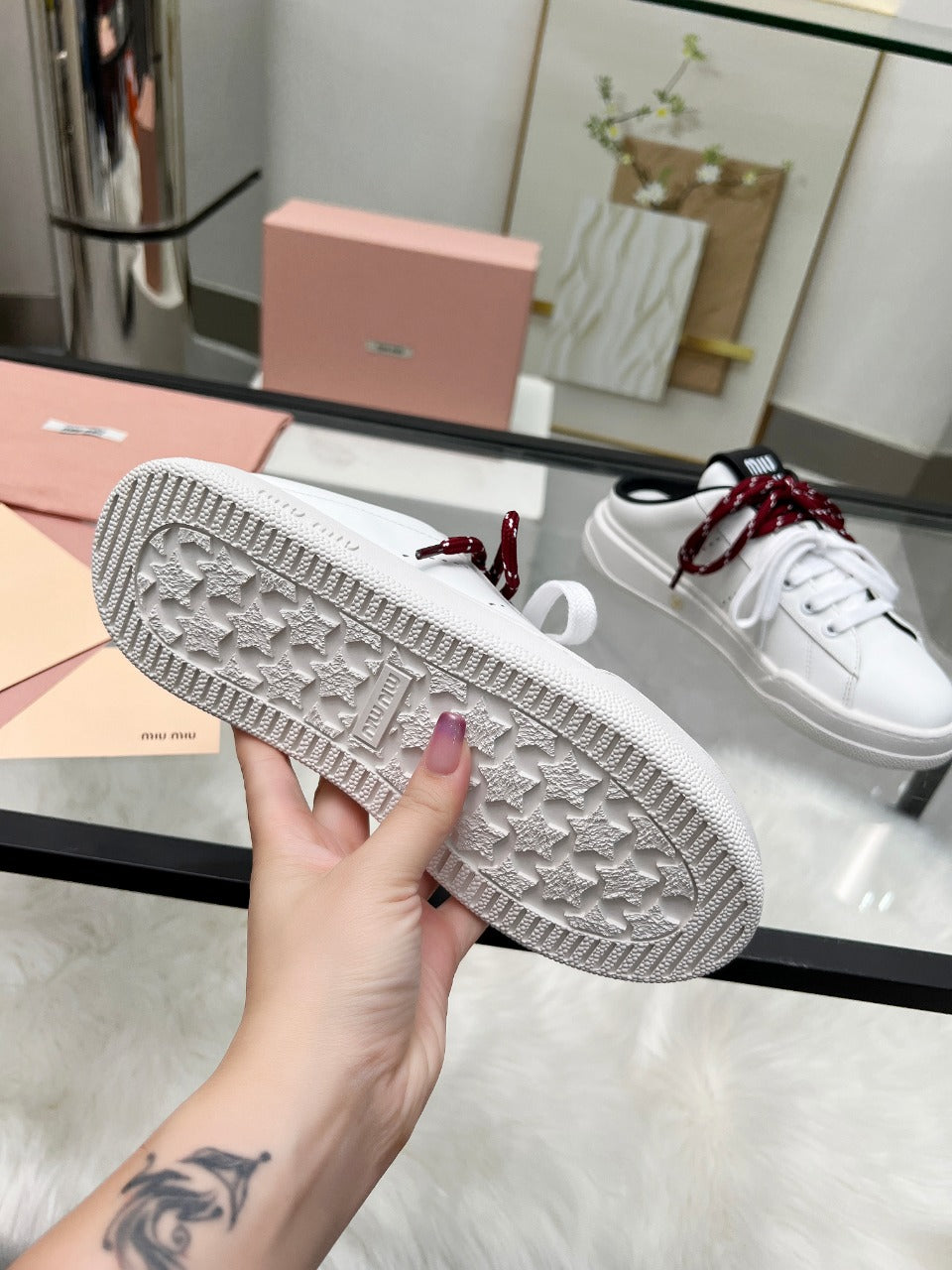 SNEAKER MULES IN BLACK AND WHITE CALFSKIN WHITE RED LACES