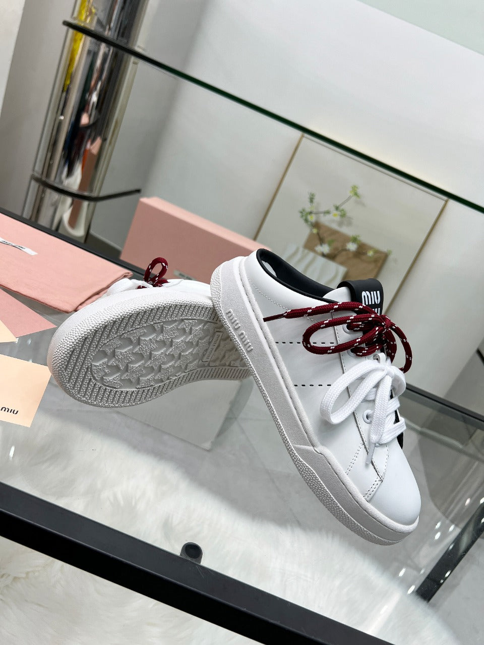 SNEAKER MULES IN BLACK AND WHITE CALFSKIN WHITE RED LACES